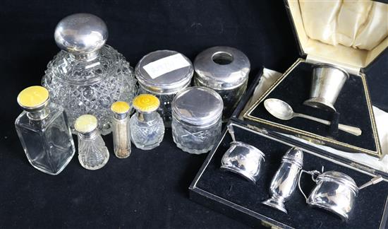 A silver topped glass scent bottle, seven other toilet jars and two cased sets.
